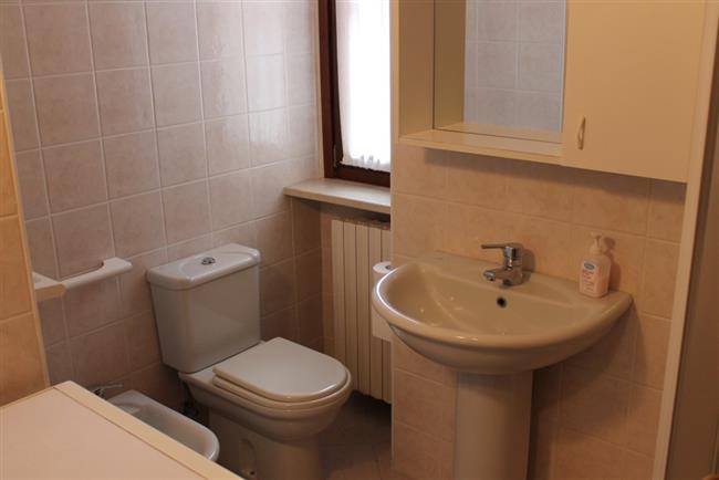 bathroom with shower and washing machine