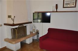 Living room with sofa and SAT-TV